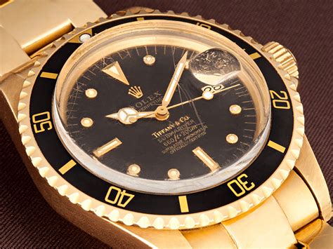 gold rolex black dial.